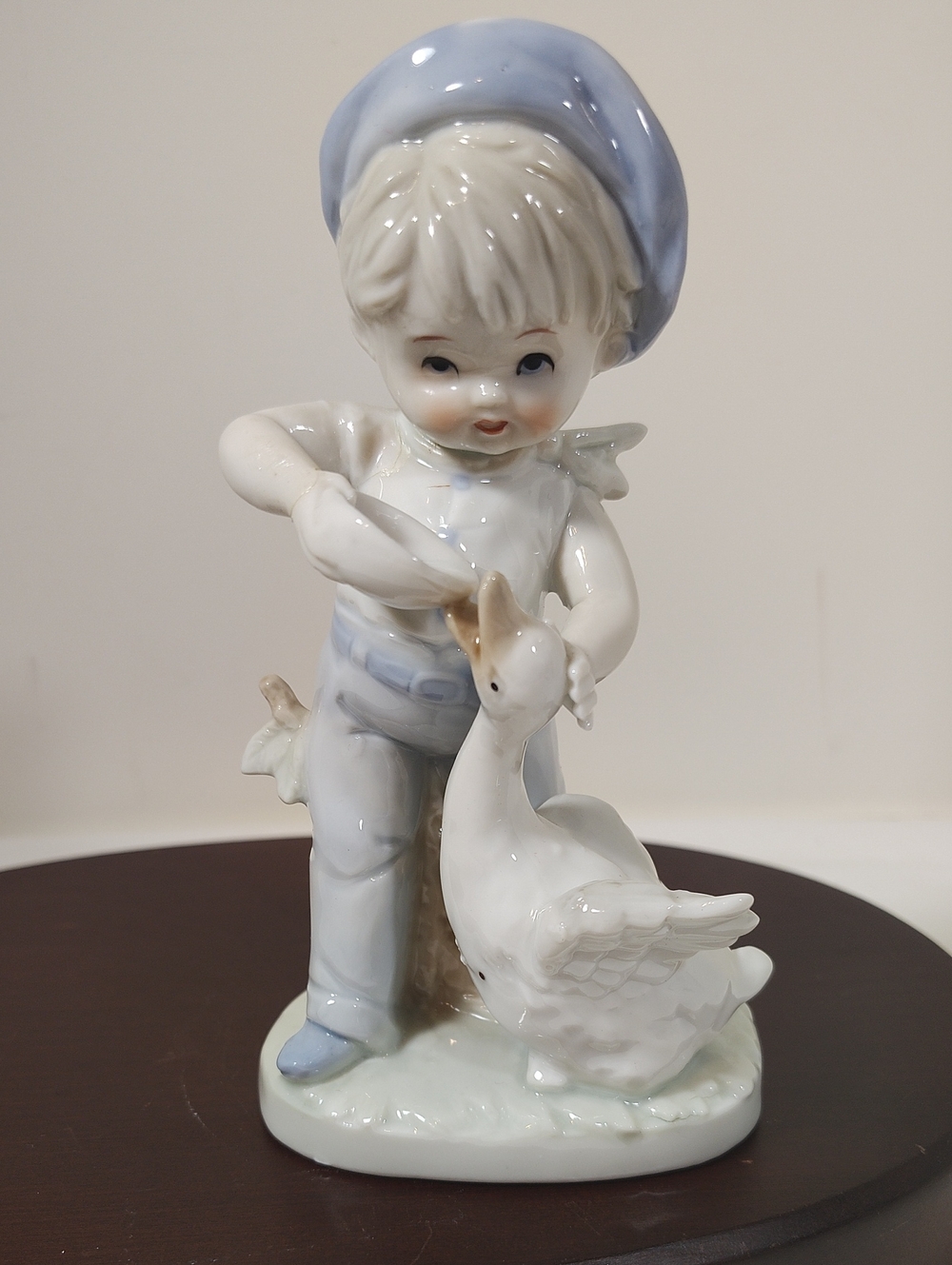 Sweet Porcelain Figurine of Boy Feeding Goose in Pale Blue